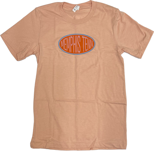A light brown Bella Canvas t-shirt with "Memphis Tenn Gas Station on Peach" printed in an orange oval logo across the chest by Choose901.