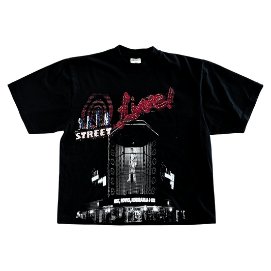 A black t-shirt featuring a graphic design with the words "Street Live!" and an image of a stage with a performer, perfect for those who still love browsing the used CD section on Spin St., is The Spin St Boxy Tee by Choose901.