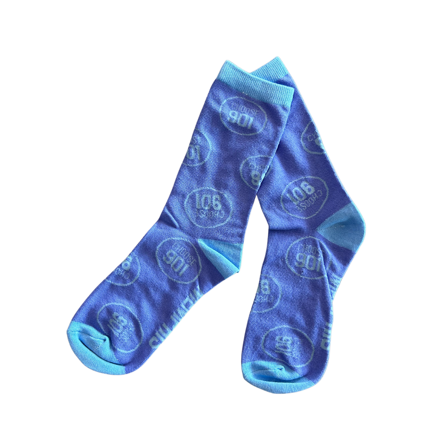 The Choose901 Party Socks from Choose901 Merch Shop offer cozy comfort and a convenient one-size-fits-all design, featuring light blue cuffs, heels, and toes. Decorated with a circular pattern displaying "100" and "Shared," they're the ideal way to showcase your M pride in style.