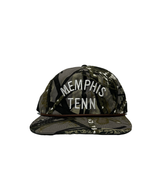A Memphis Tenn Hat Camo snapback cap with "901" printed in white letters on the front, displayed against a striped grey background. (from Choose901 Merch Shop)