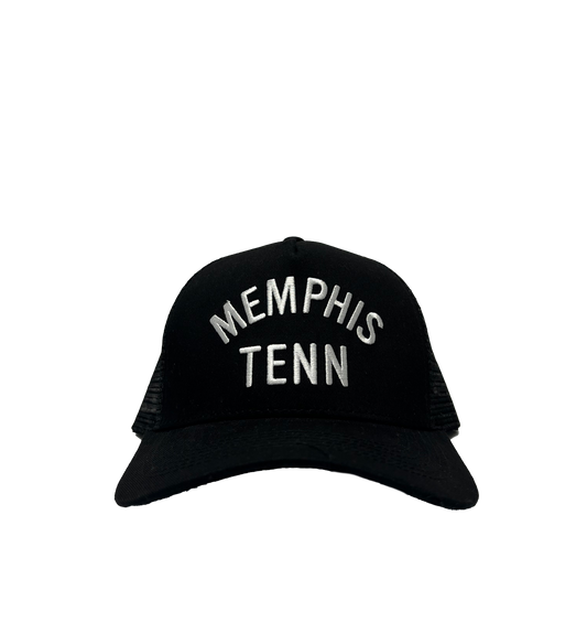 Memphis Tenn Black Trucker Hat with "901" embroidered in white letters, set against a striped gray background from Choose901 Merch Shop.