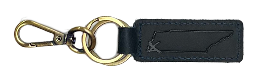 Keychain featuring a brass clip and a black leather tag with a debossed design, identified as a State with an X Blue Leather Keychain from the Choose901 Merch Shop.