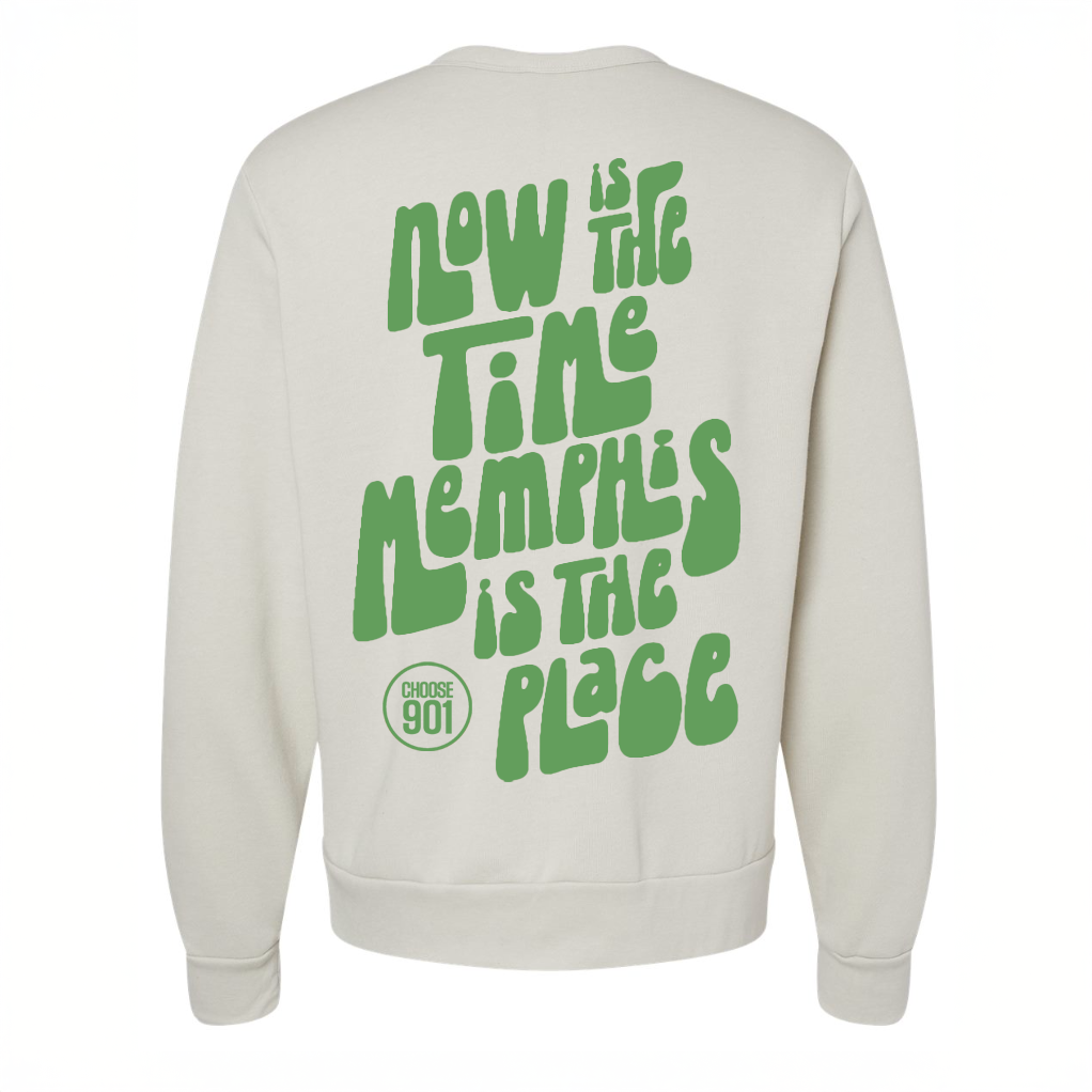 The "Now Is The Time Sweatshirt" from the Choose901 Merch Shop showcases authentic Memphis pride with its white fabric and bold green text stating, "Now is the time Memphis is the place." A circular "Choose 901" logo below adds a touch of flair. With its unisex fit, this sweatshirt offers both style and comfort akin to your favorite short sleeve tee.