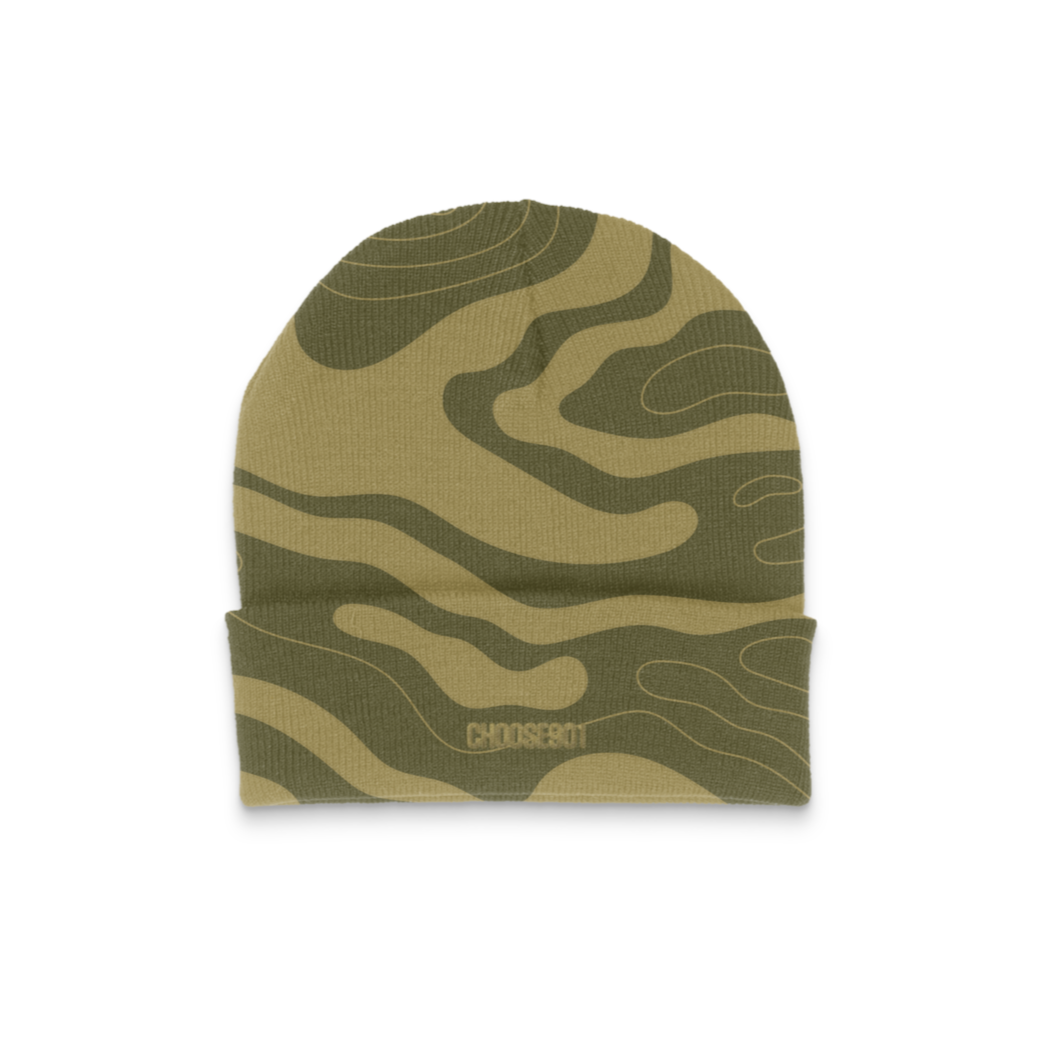 Olive green camouflage-patterned Something's in the Water Tech Beanie from Choose901 Merch Shop, featuring the "Pompei" logo on the brim, placed against a plain white background.