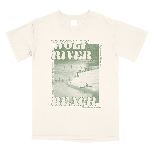 A Choose901 Wolf River Beach Shirt (Ivory) with a "wolf river beach" graphic design, featuring an image of a Memphis beach scene and the words "more than a sandbar".