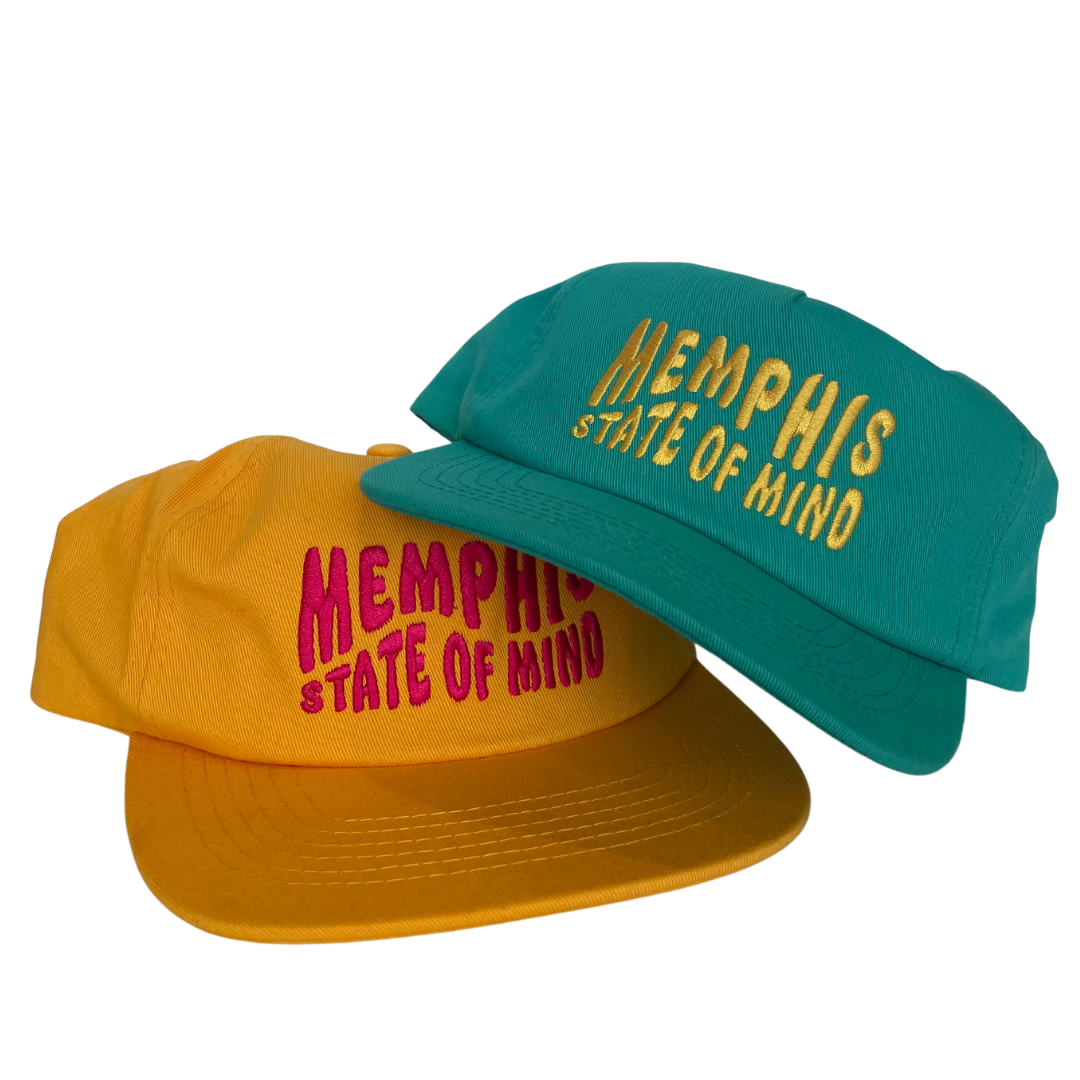 Two MEMPHIS STATE OF MIND HATS from Choose901 Merch Shop, one teal and the other yellow.